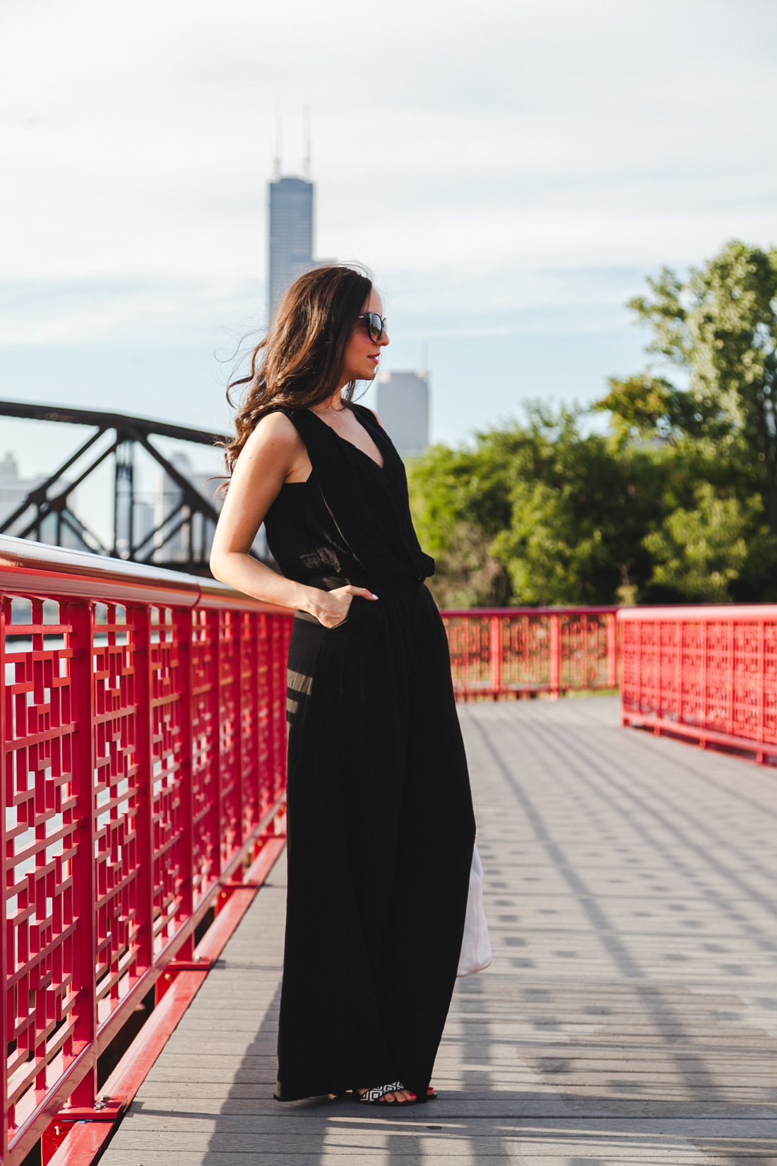 Yana Puaca of NoMad Luxuries wearing an all black pantsuit and ear cuff in Chicago Summer