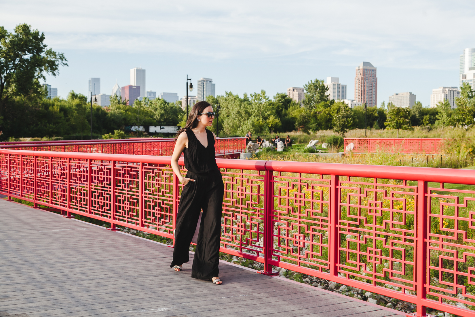 Yana Puaca of NoMad Luxuries wearing an all black pantsuit and ear cuff in Chicago Summer