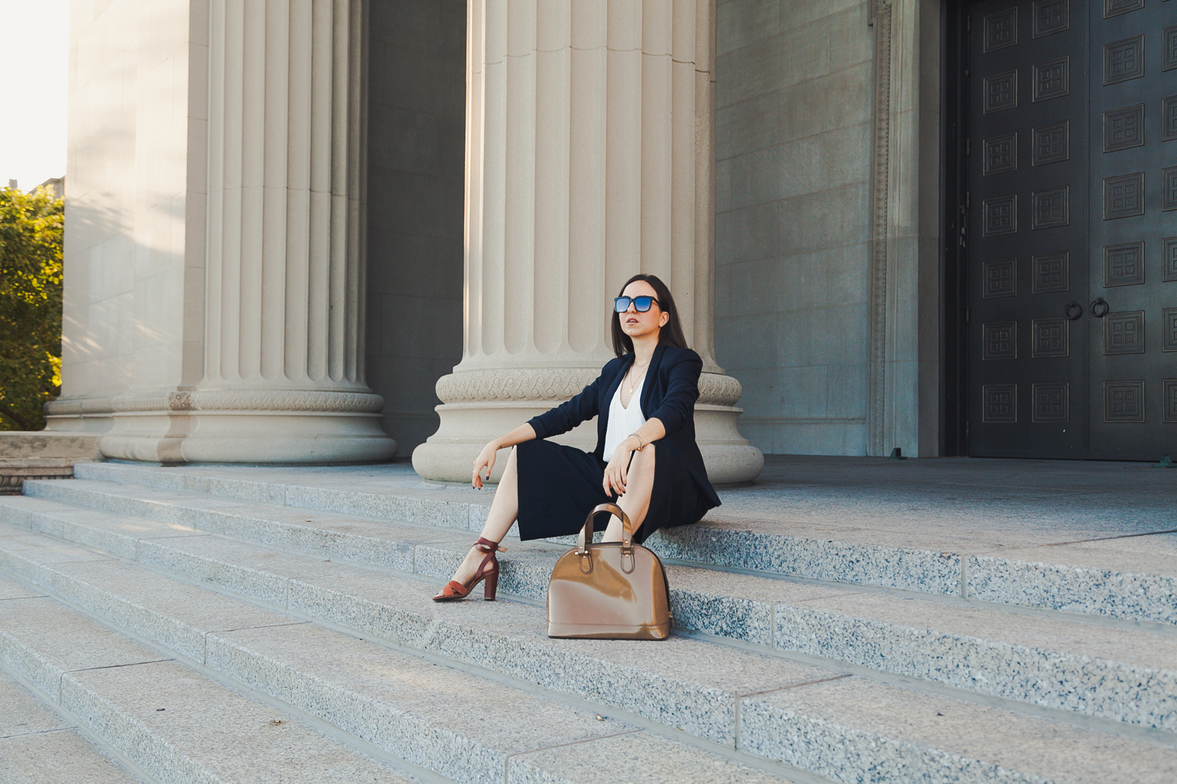 Yana Puaca of NoMad Luxuries wearing a navy suit from zara, theory and banana republic and a tjmaxx purse in Chicago for the Fall