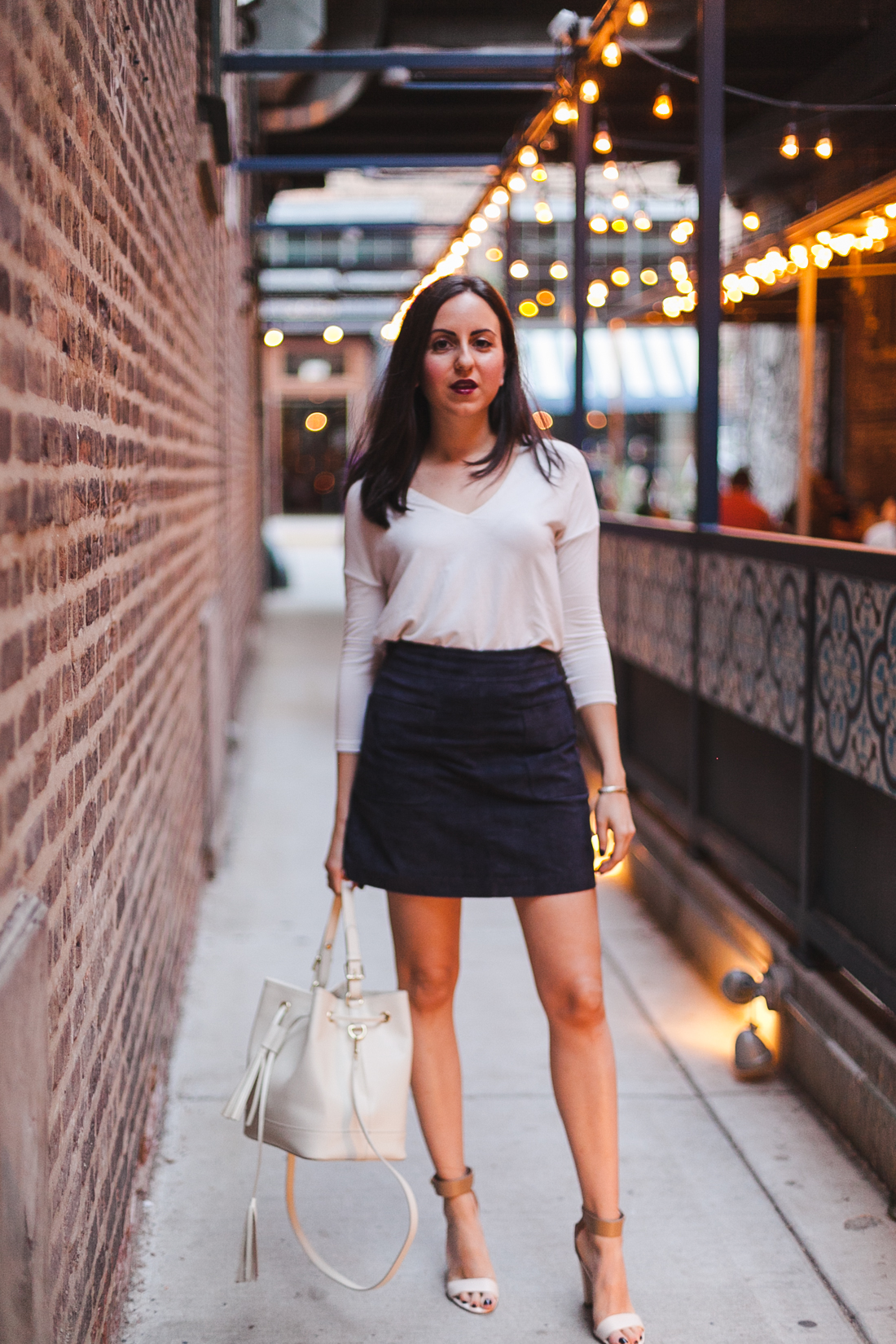 Yana Puaca of NoMad Luxuries wearing a suede mini skirt from TJ Maxx and a mango top in Chicago for the fall