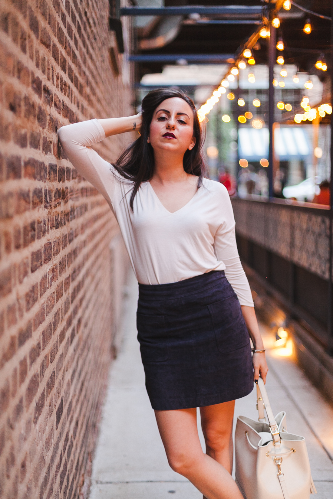 Yana Puaca of NoMad Luxuries wearing a suede mini skirt from TJ Maxx and a mango top in Chicago for the fall