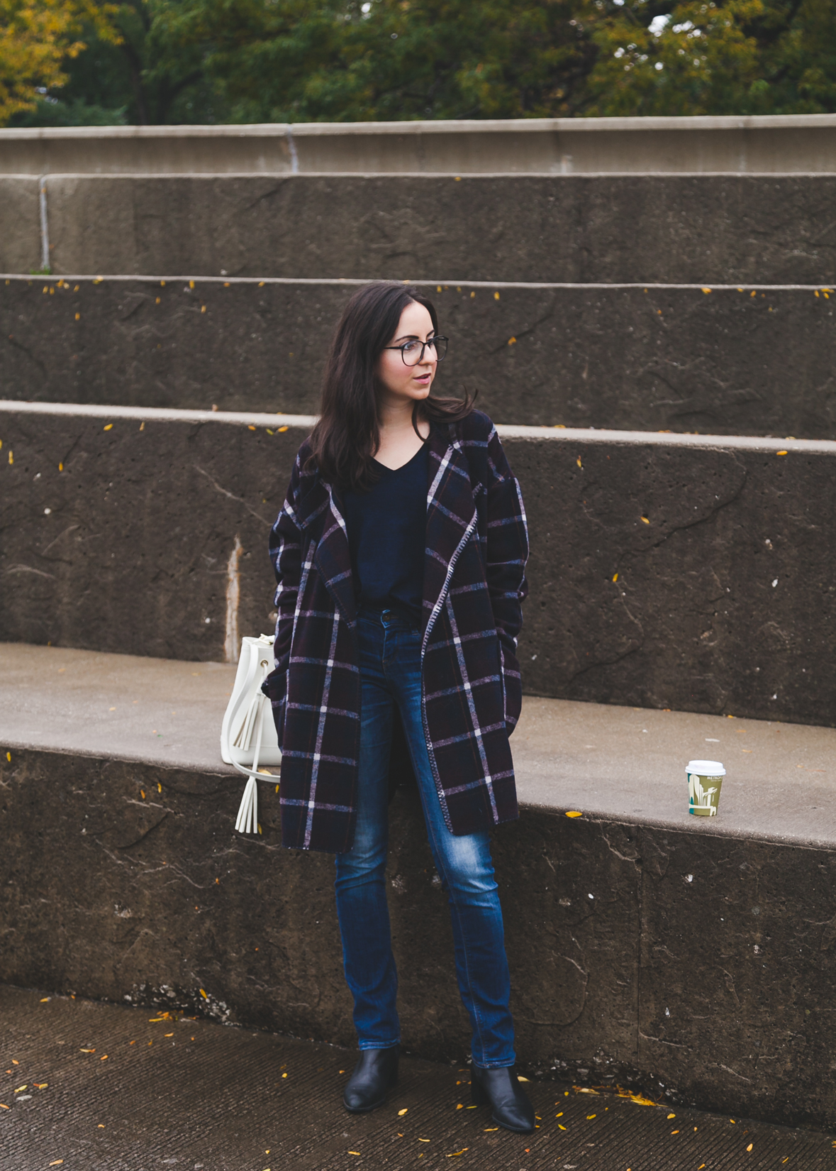 Yana Puaca of NoMad Luxuries wearing a plaid coat from TJ Maxx for the Fall in Chicago