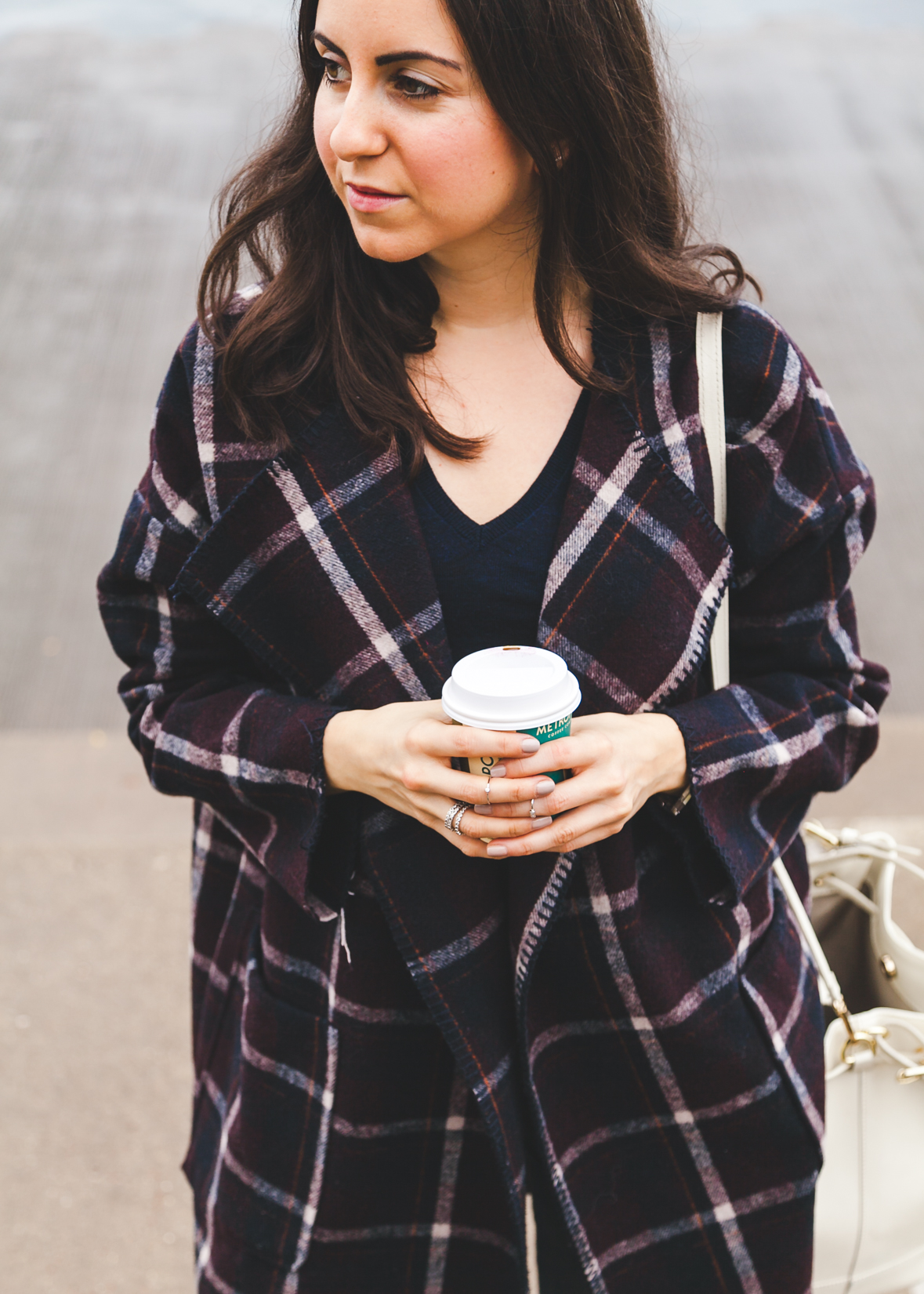 Yana Puaca of NoMad Luxuries wearing a plaid coat from TJ Maxx for the Fall in Chicago