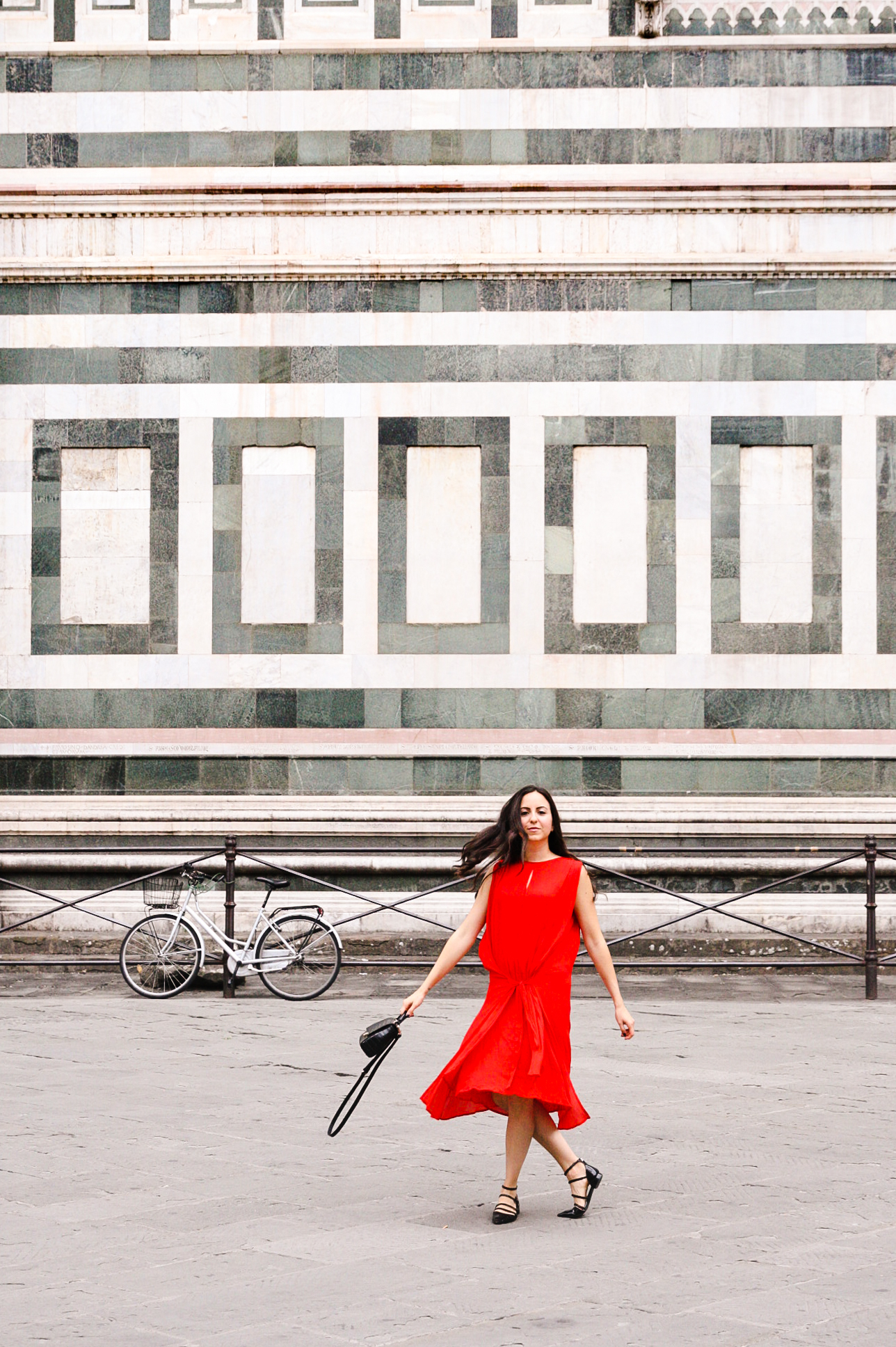 Yana Puaca of NoMad Luxuries wearing a red dress from Asos in Florence, Italy 