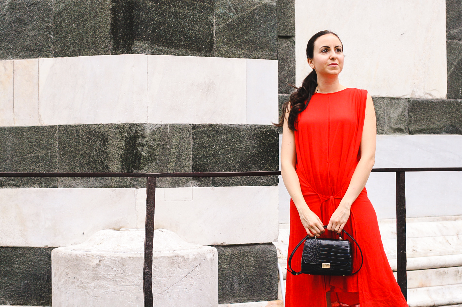 Yana Puaca of NoMad Luxuries wearing a red dress from Asos in Florence, Italy 