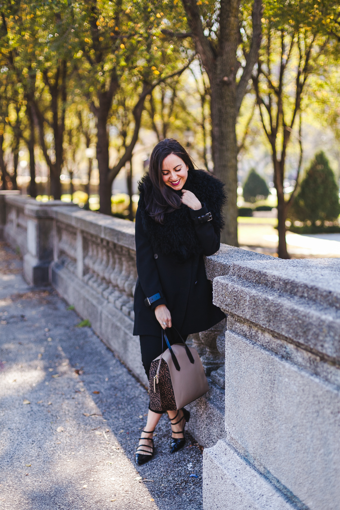 Yana Frigelis of NoMad Luxuries wearing an all black fall look in Chicago