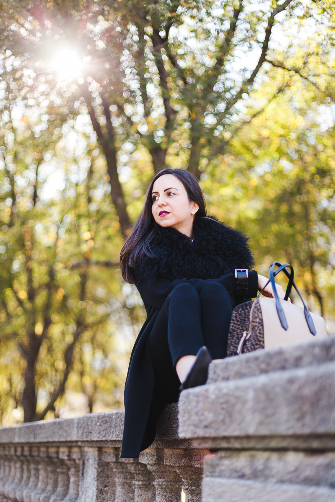 Yana Frigelis of NoMad Luxuries wearing an all black fall look in Chicago