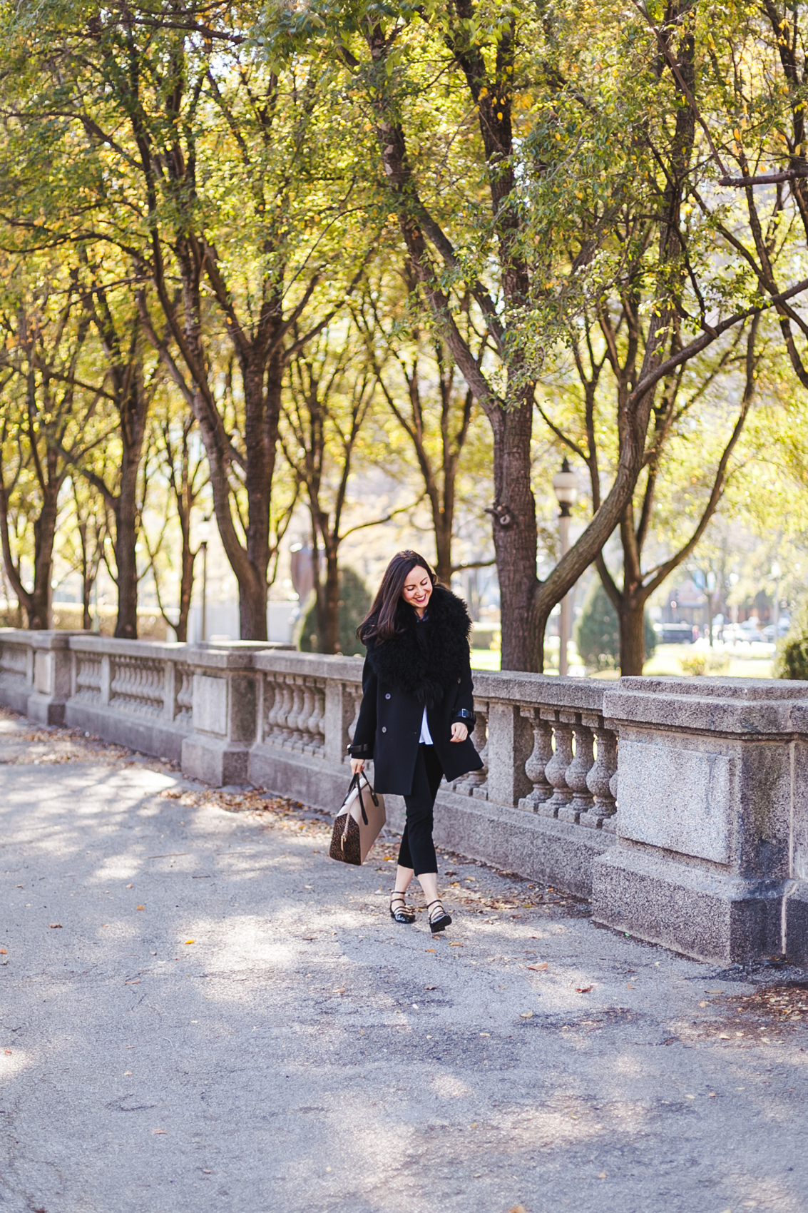 Yana Frigelis of NoMad Luxuries wearing an all black fall look in Chicago