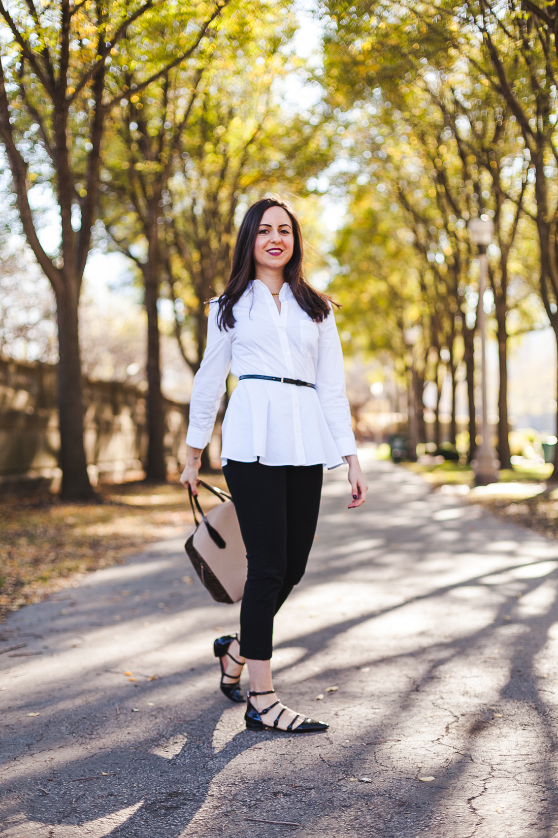 Yana Frigelis of NoMad Luxuries wearing an all black fall look in Chicago