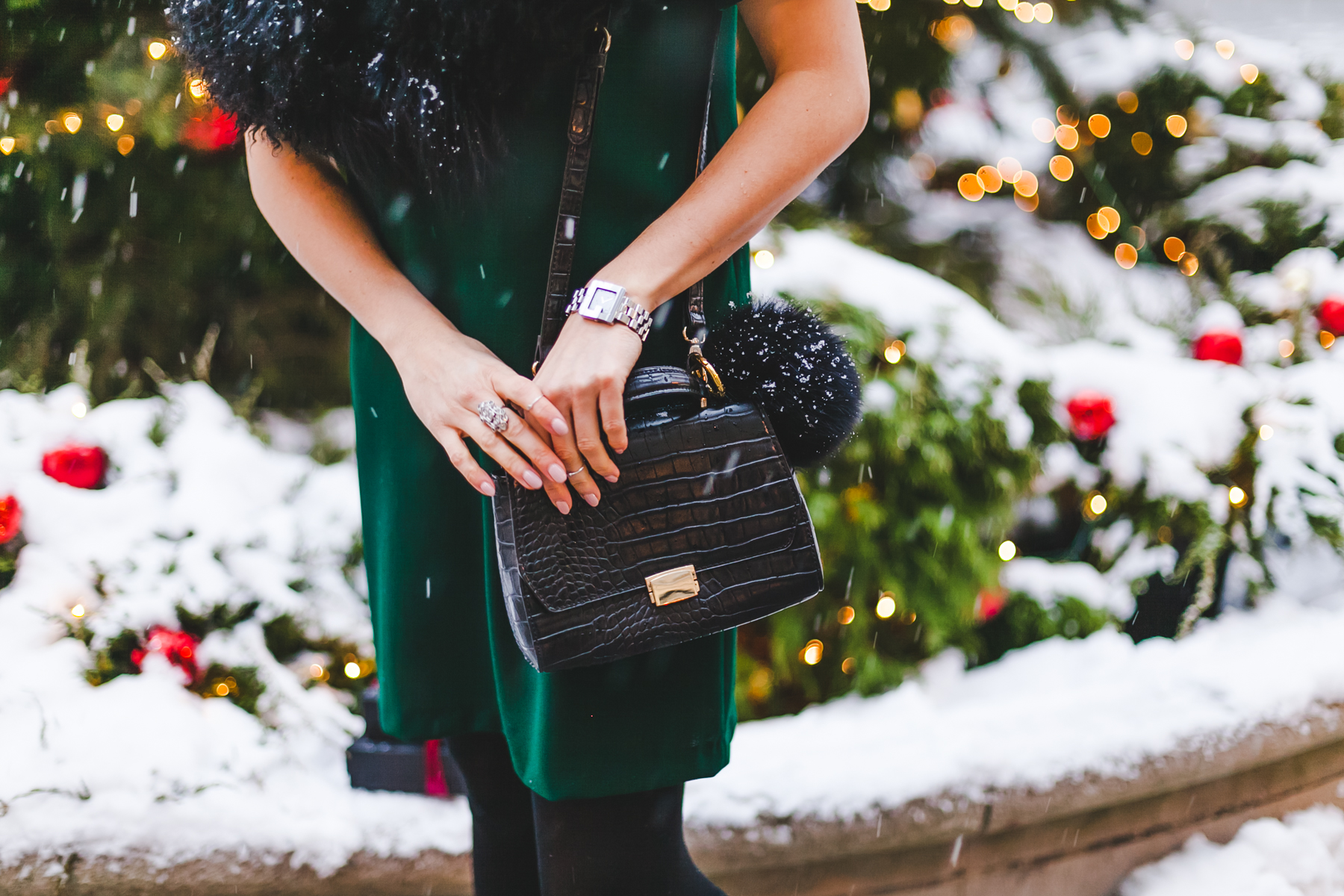 Yana Frigelis of NoMad Luxuries wears a green cocktail dress from zara and a fur scarf from asos for the holidays 