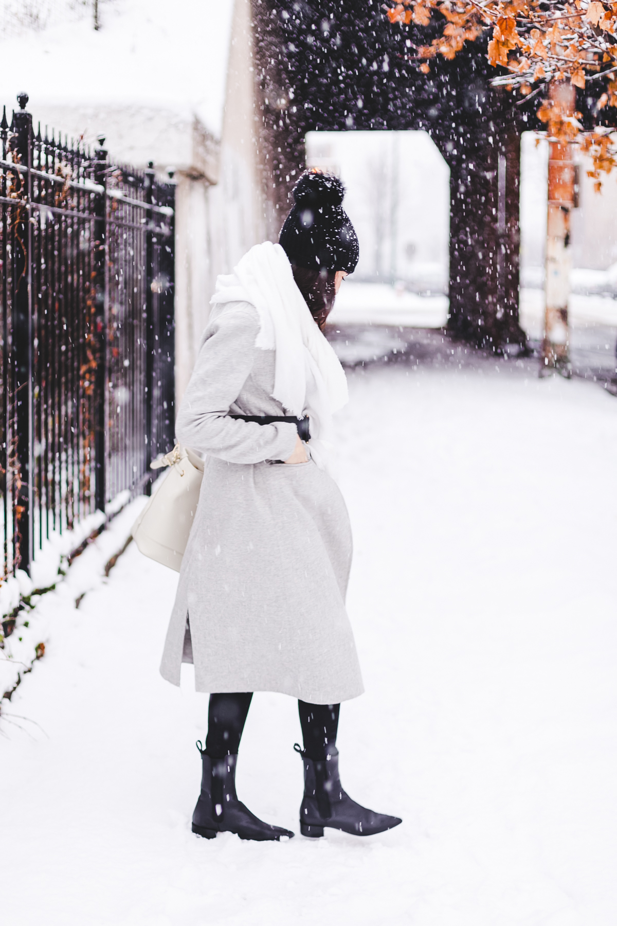 Yana Frigelis of NoMad Luxuries wearinga gray wool coat from zara for winter and new years resolutions