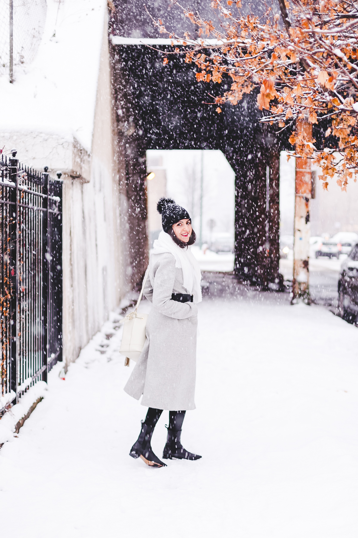 Yana Frigelis of NoMad Luxuries wearinga gray wool coat from zara for winter and new years resolutions