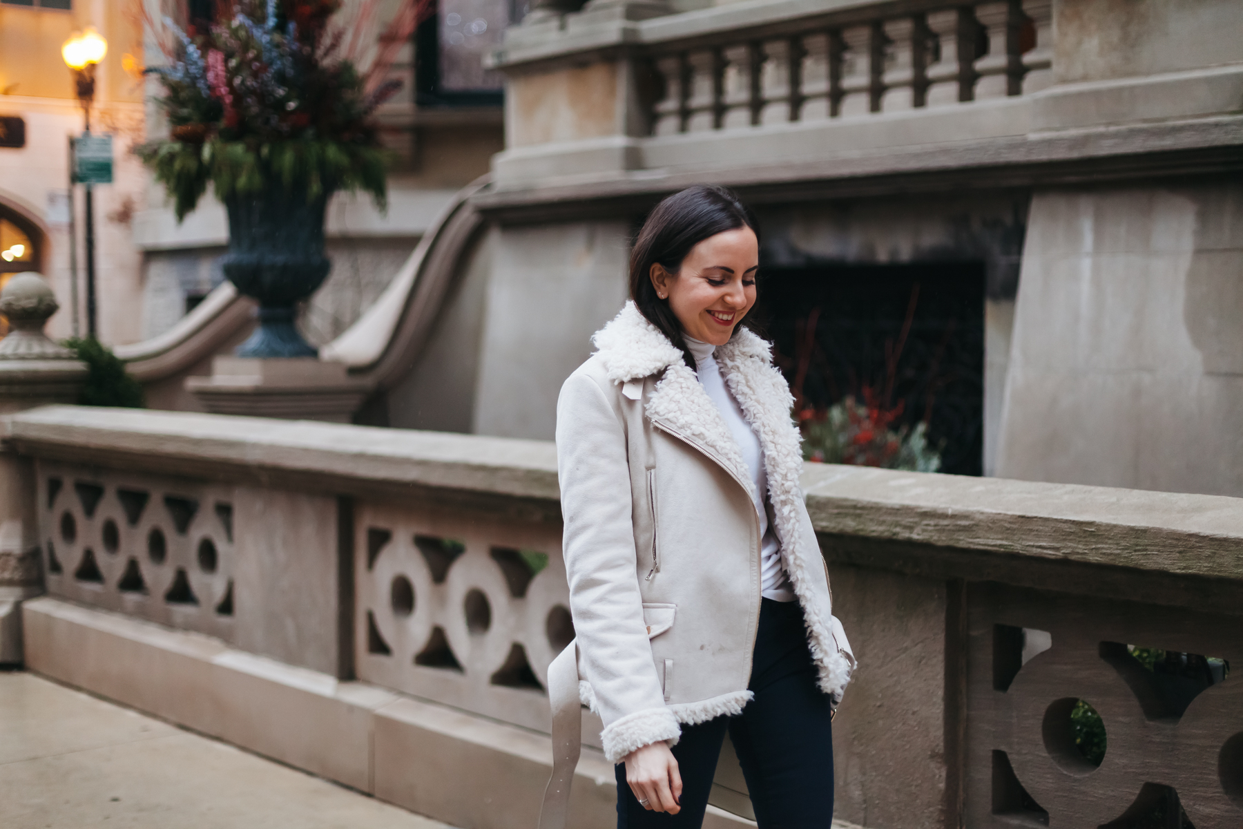 Yana Frigelis of NoMad Luxuries wearing a shearling jacket from zara and studded boots from topshop for winter style in chicago