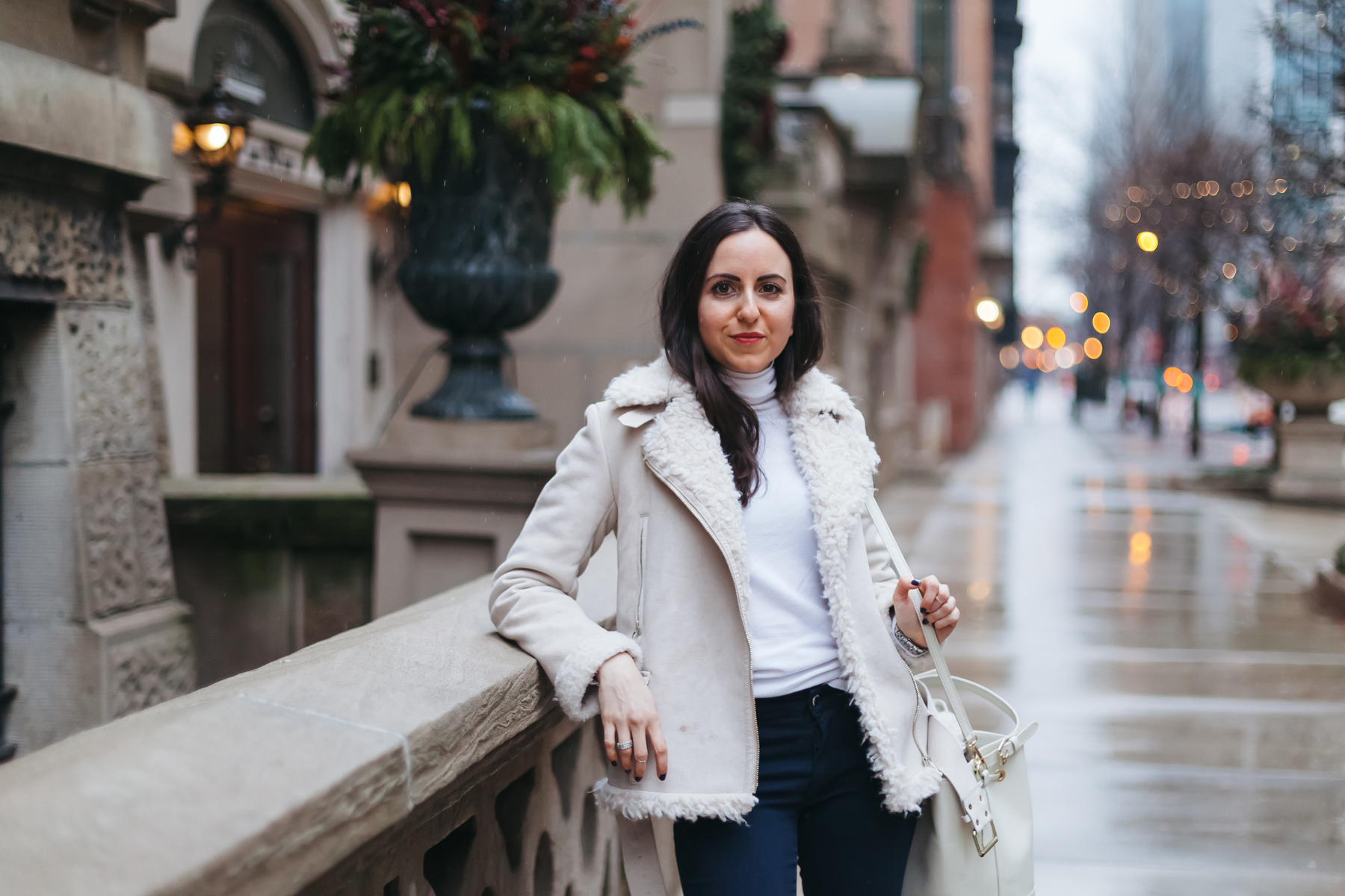Yana Frigelis of NoMad Luxuries wearing a shearling jacket from zara and studded boots from topshop for winter style in chicago