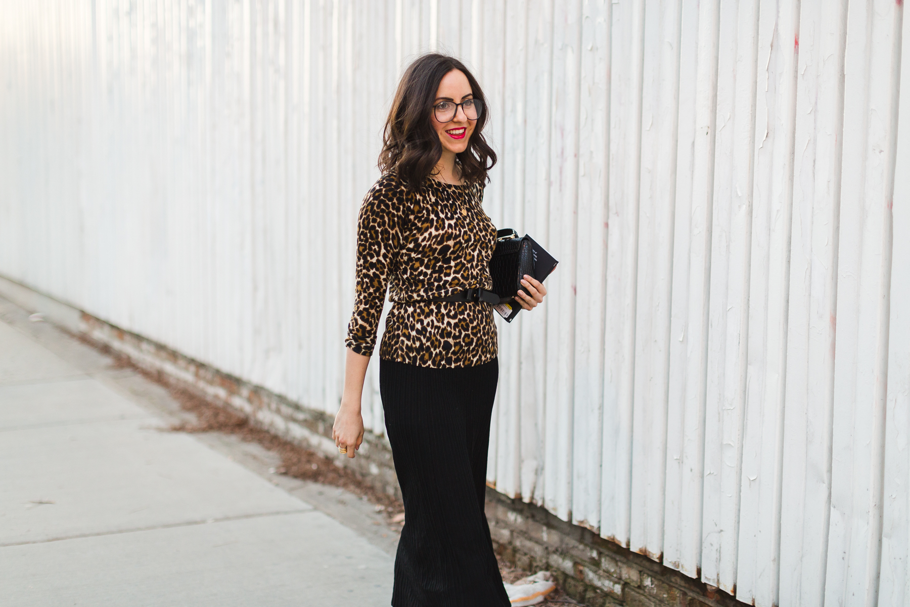Yana Frigelis of NoMad Luxuries wearing a leopard sweater from Jcrew and a midi length skirt from mango for a classic look