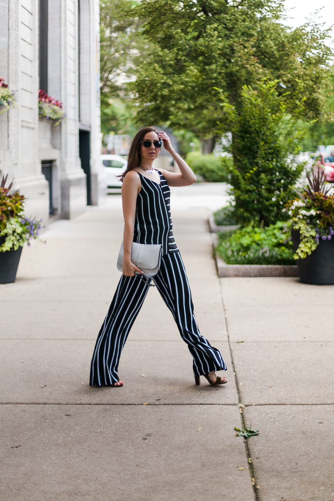 Yana Frigelis of NoMad Luxuries wearing a striped coord set transitioning into fall wardrobe 