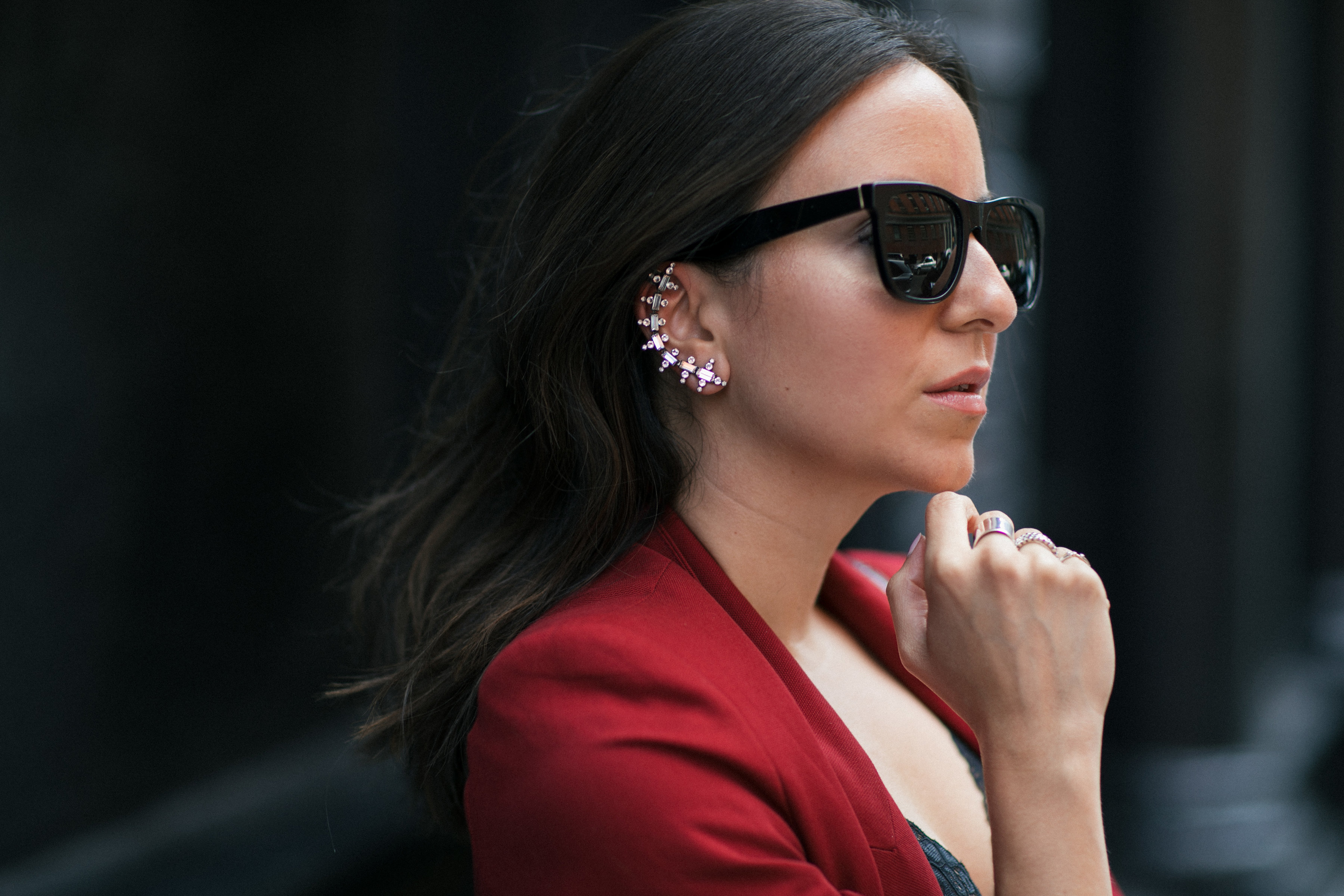 Yana Frigelis of NoMad Luxuries wearing Fall's it color of the season red for new york fashion week in a pant suit from Zara