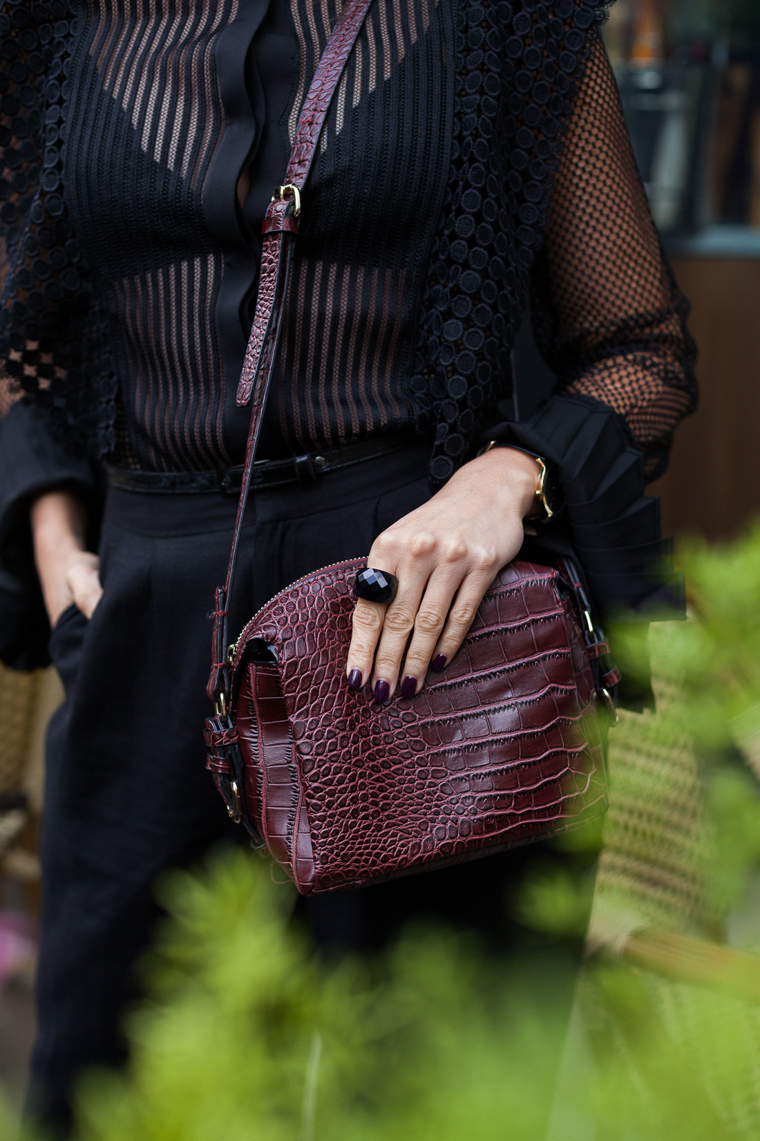 Yana Frigelis of NoMad Luxuries shares how to style a sheer, black lace top with palazzo pants for the Fall 