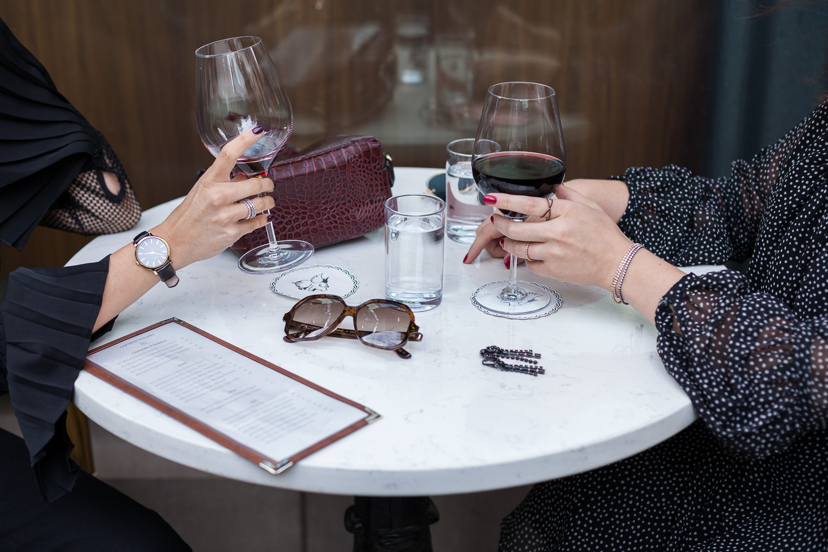 Yana Frigelis of NoMad Luxuries shares how to style a sheer, black lace top with palazzo pants for the Fall 