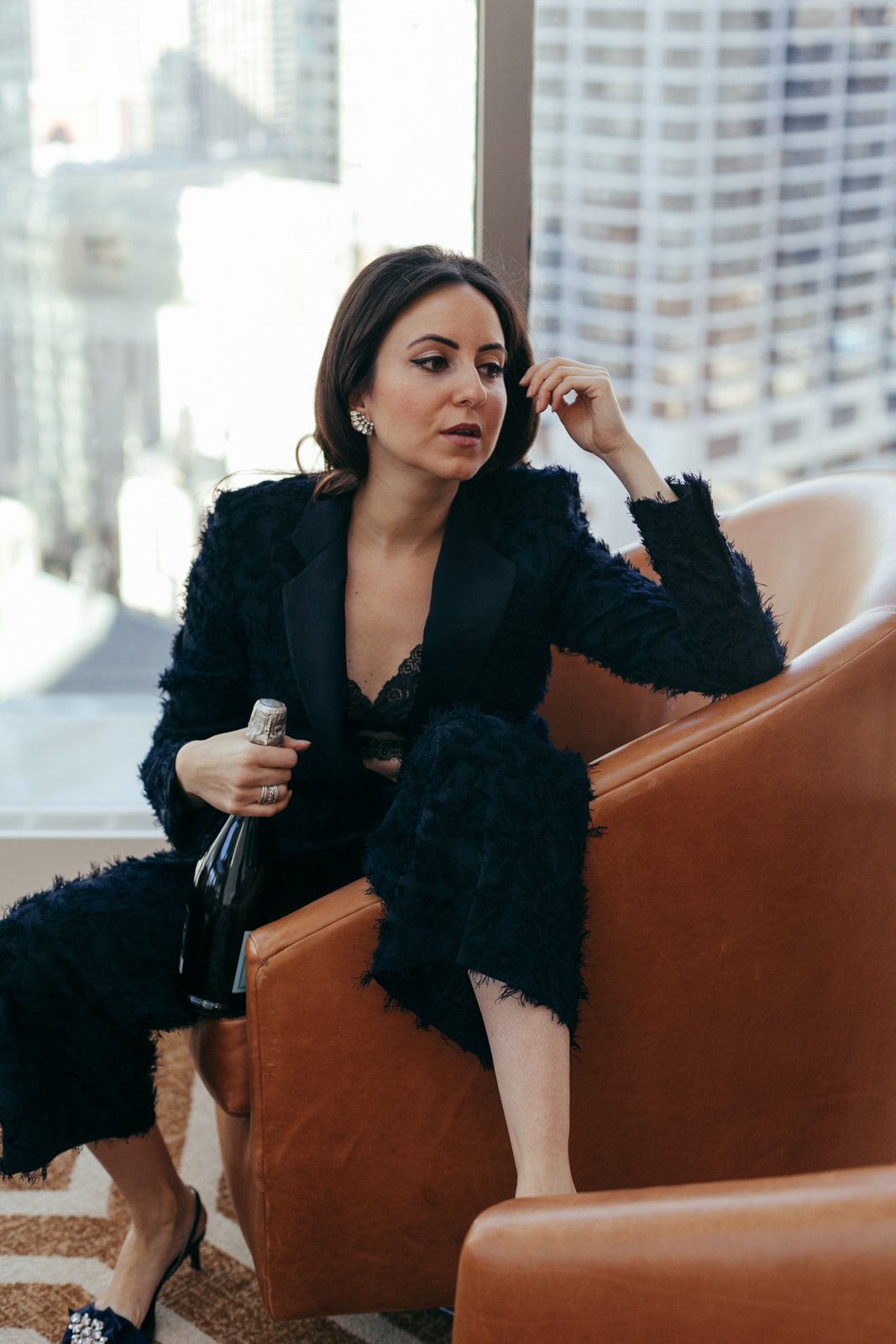 Yana Frigelis of NoMad Luxuries styles a navy blue suit for New Year's Eve Celebrations 