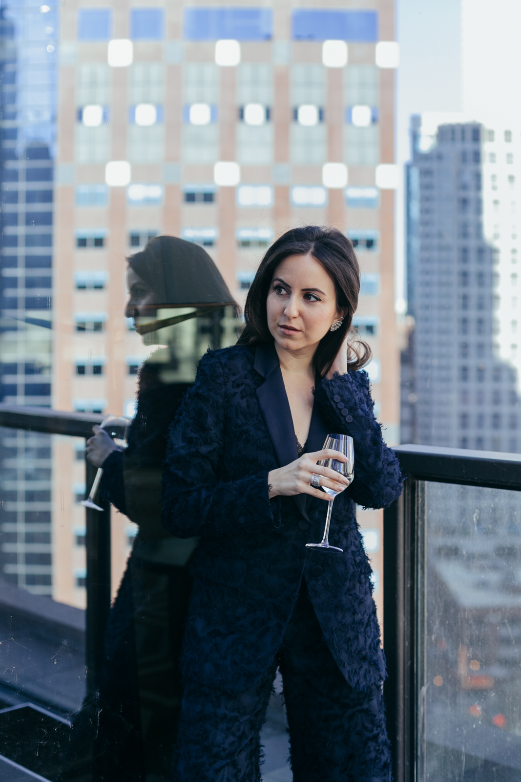 Yana Frigelis of NoMad Luxuries styles a navy blue suit for New Year's Eve Celebrations 