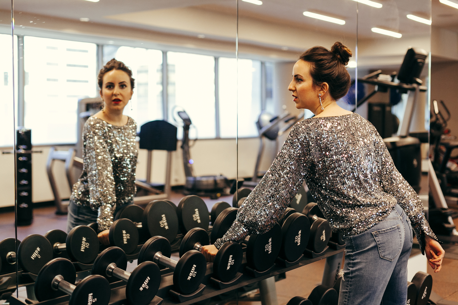 Yana Frigellis of NoMad Luxuries wearing a Trina Turk sequin top for a New Year Mantra in 2018