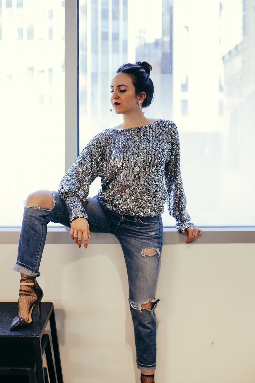 Yana Frigellis of NoMad Luxuries wearing a Trina Turk sequin top for a New Year Mantra in 2018