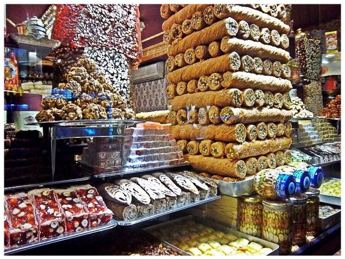 Nomad Luxuries image capturing Turkish sweets within marketplace.