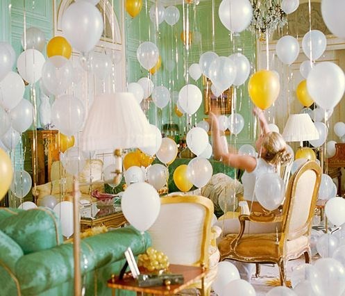 Nomad Luxuries vibrant photo displaying room filled with balloons 