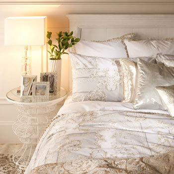 Nomad Luxuries photo of luxe bed comforter from Zara home. 