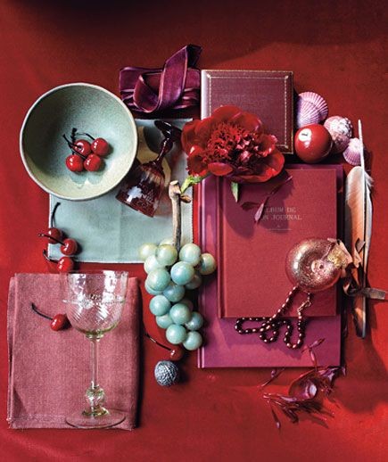 Nomad Luxuries deep cranberry color schemed mood board for the holidays. 