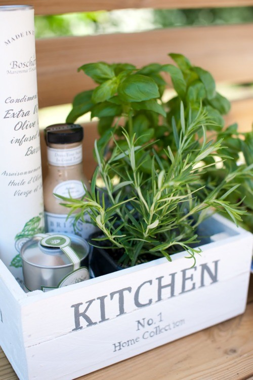 Nomad Luxuries; small kitchen crate filled with condiments and herbs. 