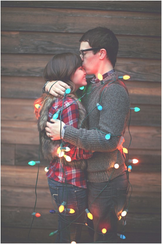 Nomad Luxuries warm and lighthearted couples holiday photo shoot with lights. 