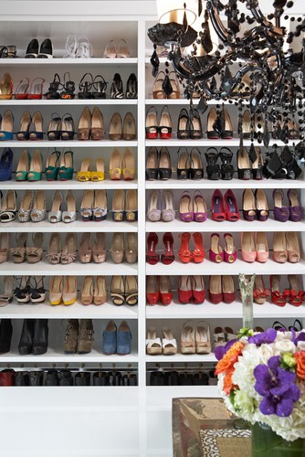Nomad Luxuries photo inspiration for shoe organization; organized shoes by color and type. 