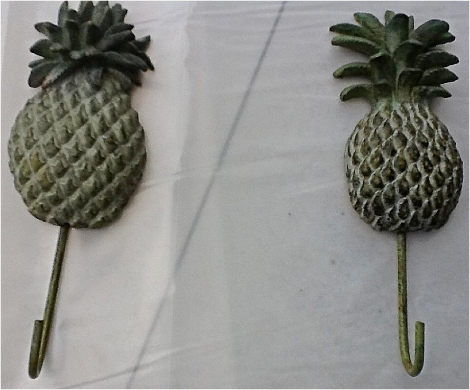 Nomad Luxuries photo of pineapple coat hangers. 