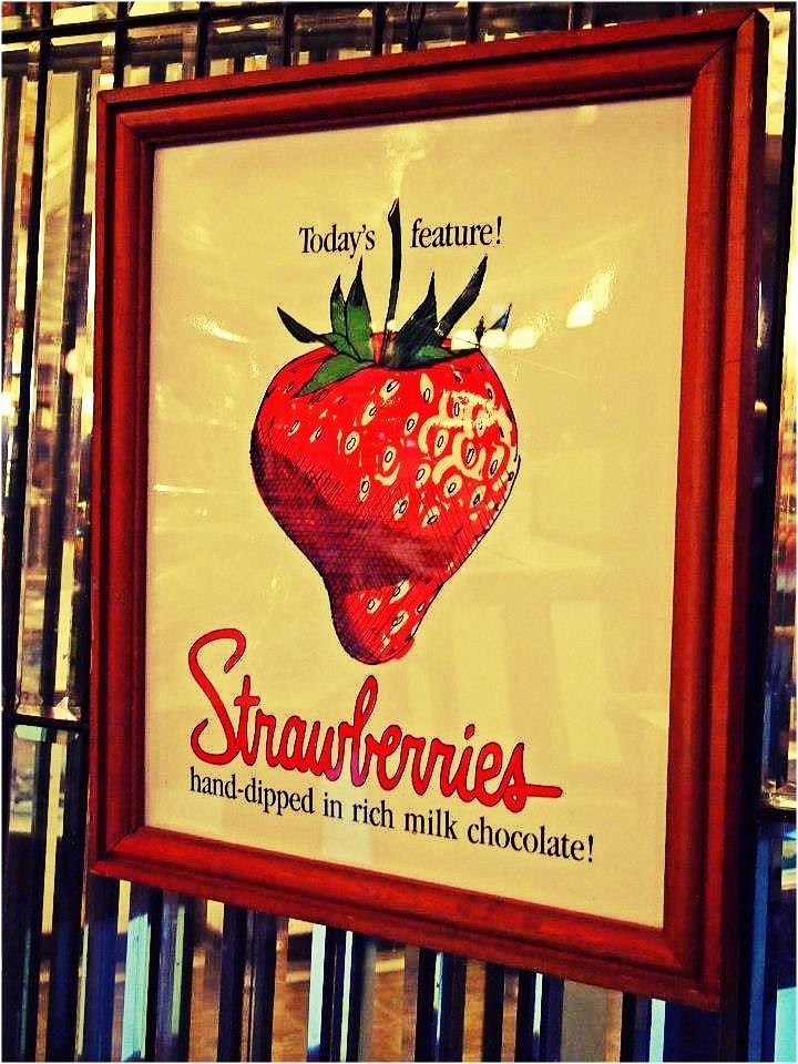 Nomad Luxuries photo of vintage strawberry sign.