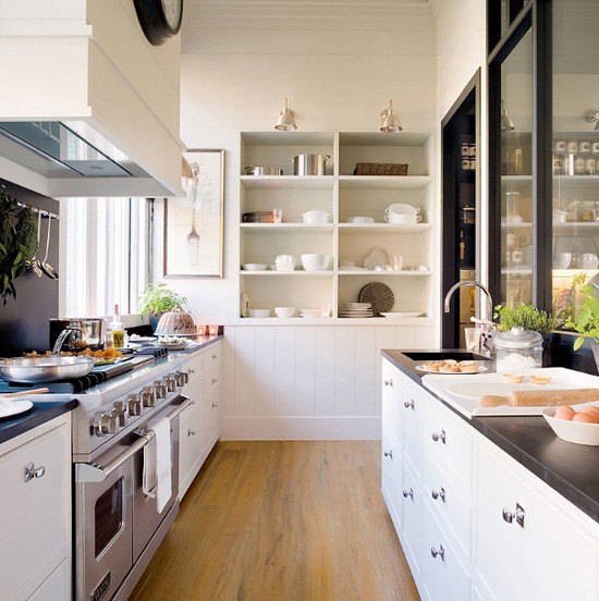 Nomad Luxuries white and industrial kitchen with modern spin.
