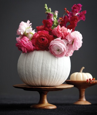 Nomad Luxuries painted pumpkin decorated with roses.
